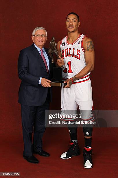 Commissioner David Stern and 2011 NBA MVP Derrick Rose of the Chicago Bulls pose with the KIA Motors NBA MVP Trophy on May 4, 2011 in the 2011 NBA...