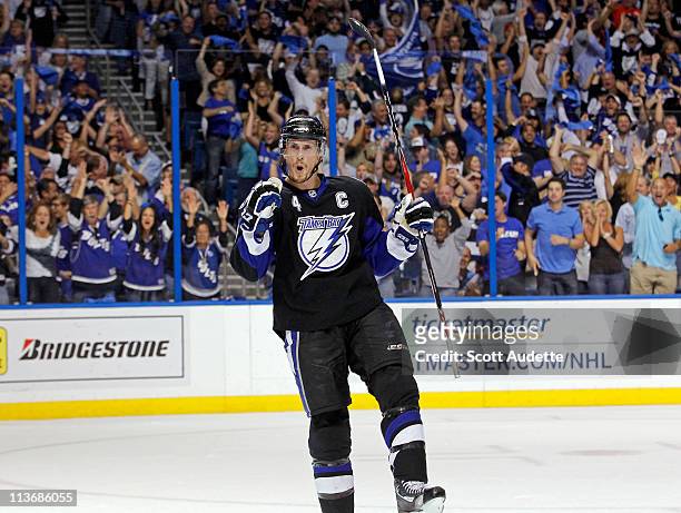 Vincent Lecavalier of the Tampa Bay Lightning reacts after Ryan Malone goal in the first period against the Washington Capitals in Game Four of the...