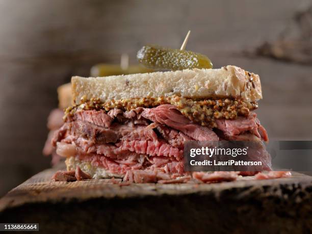 slow roasted, roast beef sandwich - roast beef sandwich stock pictures, royalty-free photos & images