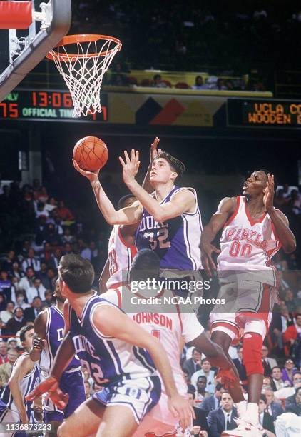 Duke University forward Christian Laettner finds himself surrounded by UNLV defenders on his way to the basket during the NCAA Photos via Getty...