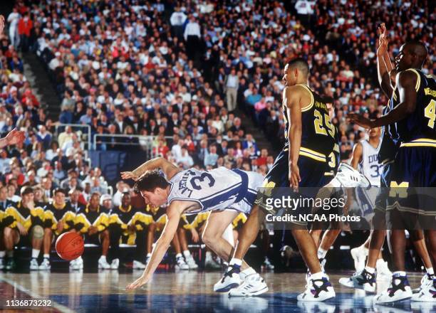 Duke University forward Christian Laettner scrambles to save the ball from going out of bounds during the NCAA Photos via Getty Images National...