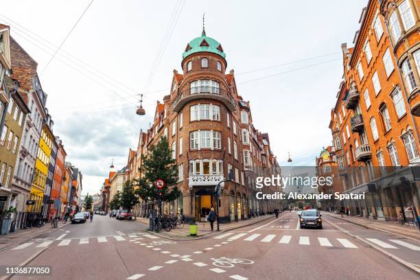street with historical buildings in copenhagen, denmark - street style shopping stock pictures, royalty-free photos & images