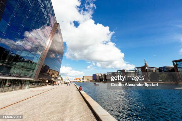 modern glass buildings along the waterfront in copenhagen, denmark - christianshavn stock pictures, royalty-free photos & images