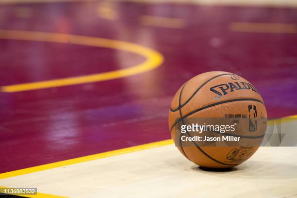 The official Spalding game basketball sits on the court between gameplay during the second half between the Cleveland Cavaliers and the Atlanta Hawks...