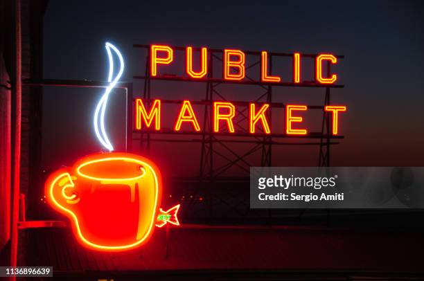 public market and coffee cup neon signs - seattle coffee stock pictures, royalty-free photos & images