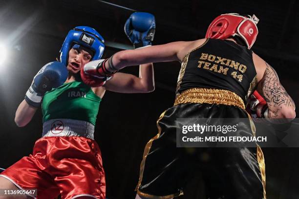 Iran's Sadaf Khadem fights against France's Anne Chauvin during an amateur boxing 3 rounds match on April 13, 2019 in Royan, western France. - Sadaf...