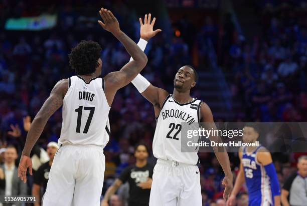 Ed Davis and Caris LeVert of the Brooklyn Nets celebrate against the Philadelphia 76ers in the second half during Game One of the first round of the...