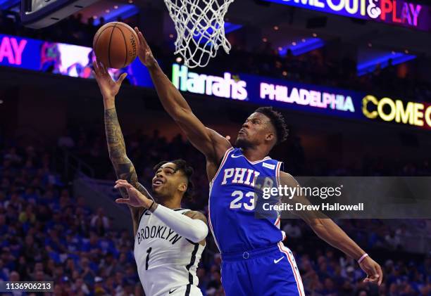 Angelo Russell of the Brooklyn Nets has his shot blocked by Jimmy Butler of the Philadelphia 76ers in the first half during Game One of the first...