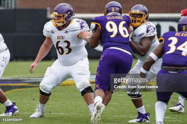East Carolina Pirates Donovan Noel and East Carolina Pirates Jaison Fournet blocks East Carolina Pirates D'Angelo McKinnie during the Purple Gold...