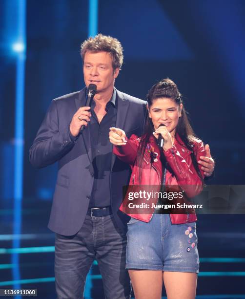 Oliver Geissen stands beside Joana Kesenci during the second event show of the tv competition "Deutschland sucht den Superstar" at Coloneum on April...