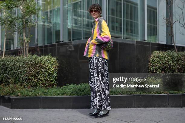 Chloe Hill is seen wearing tie dye jacket, black/white swirl pattern skirt during the Amazon Fashion Week TOKYO 2019 A/W on March 19, 2019 in Tokyo,...