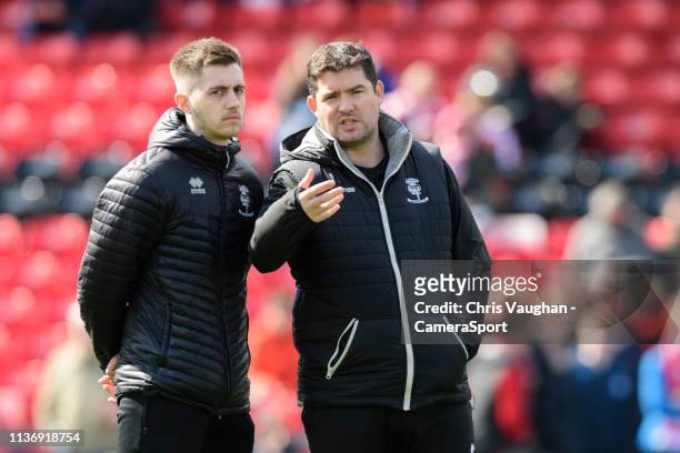 Lincoln City's strength and conditioning/sports massage Kieran Walker, left, and Lincoln City's medical consultant Ross Poynton during the pre-match...