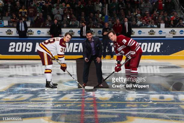Former NHL player Brian Gionta drops the puck for a ceremonial face off between Parker Mackay of the Minnesota-Duluth Bulldogs and Niko Hildenbrand...
