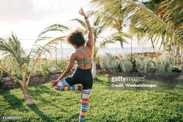 woman practicing yoga - bridgetown barbados stockfoto's en -beelden