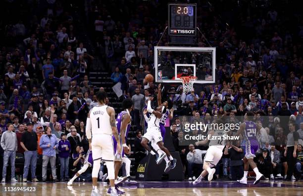 Rondae Hollis-Jefferson of the Brooklyn Nets makes the game-winning shot while guarded by Marvin Bagley III of the Sacramento Kings with two seconds...