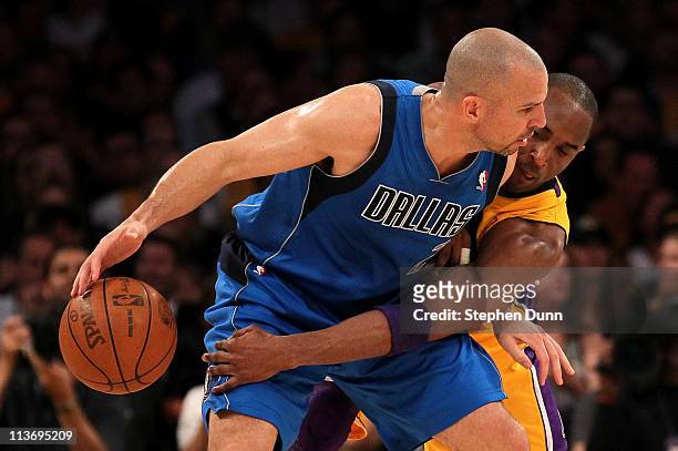 Jason Kidd of the Dallas Mavericks moves the ball as Kobe Bryant of the Los Angeles Lakers goes for the steal in the first quarter in Game Two of the...