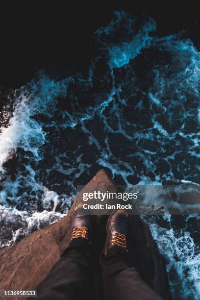 standing above the rough sea - leap of faith stock pictures, royalty-free photos & images