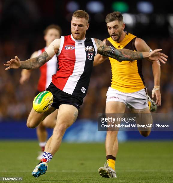 Tim Membrey of the Saints and Ricky Henderson of the Hawks in action during the 2019 AFL round 04 match between the St Kilda Saints and the Hawthorn...