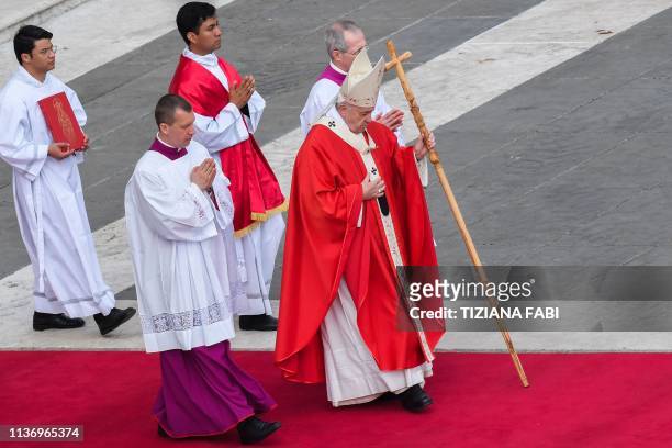 Pope Francis walks across St. Peter's square during the Palm Sunday mass on April 14, 2019 in the Vatican.