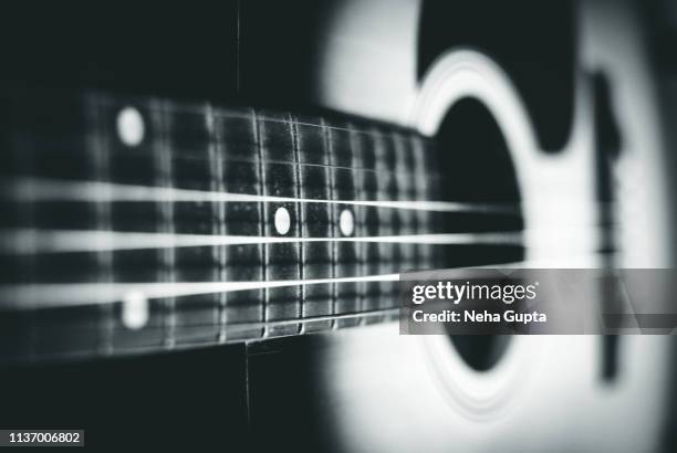 close up of an acoustic guitar - monochrome - classical music background stock pictures, royalty-free photos & images