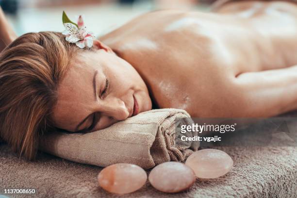 beauty treatments and massage - himalayan salt stock pictures, royalty-free photos & images