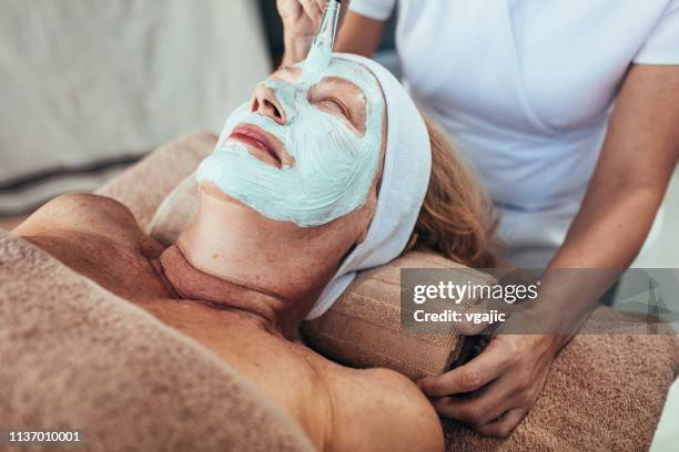 beauty treatments and massage - facial cleanse stock pictures, royalty-free photos & images