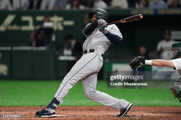 Outfielder Domingo Santana of the Seattle Mariners hits a grand slam to make it 5-2 in the 3rd inning during the game between Seattle Mariners and...