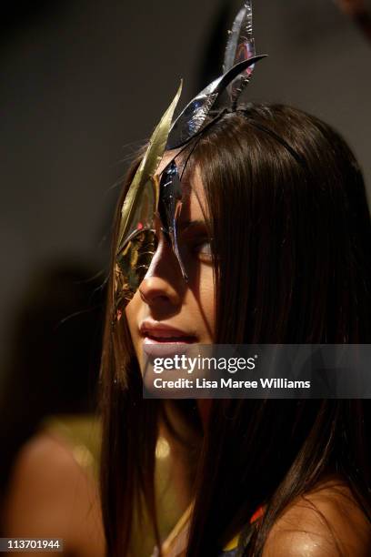 Model poses backstage ahead of the Lisa Blue show during Rosemount Australian Fashion Week Spring/Summer 2011/12 at Overseas Passenger Terminal on...