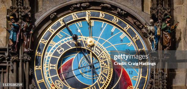 prague czechia view of iconic astrological clock tower face - holiday hours stock-fotos und bilder