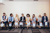Photo of candidates waiting for a job interview.