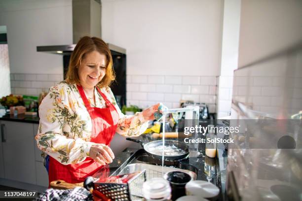 washing the dishes after dinner party - eccentric hobby stock pictures, royalty-free photos & images