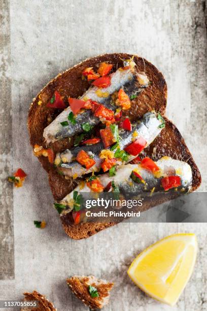 bruschetta and small sandwiches with sardine,toasted bread,snack or appetizer,sardine, sandwich,food - crostini imagens e fotografias de stock