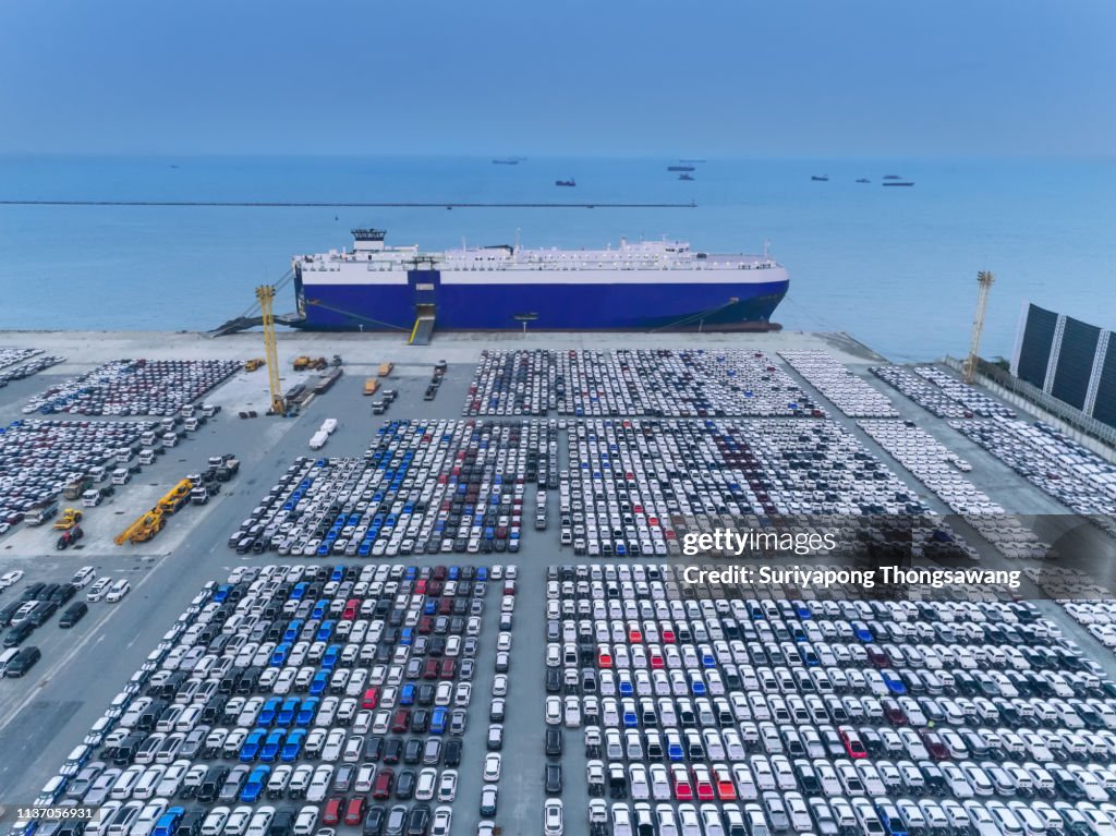 Aerial view Car loading to Large RoRo (Roll on/off) Carrier vessel for shipping to worldwide.