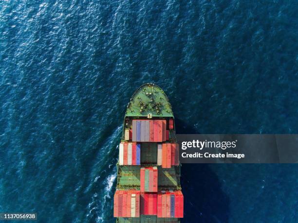 aerial top view container ship on deep sea delivery container for logistics, import export, shipping or transportation. - shipping container top view - fotografias e filmes do acervo