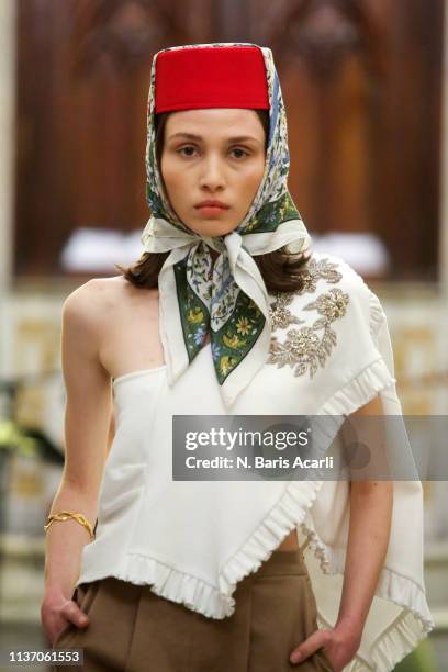 Model walks the runway at the Asli Filinta show during Mercedes-Benz Istanbul Fashion Week at the Zorlu Performance Hall on March 20, 2019 in...