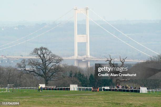 Runners in The Brett Martin Daylight Systems Handicap Chase make their way down the back straight with the Severn Bridge behind at Chepstow...