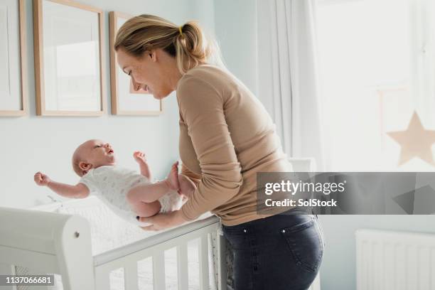 mother baby bonding - baby sleeping stock pictures, royalty-free photos & images