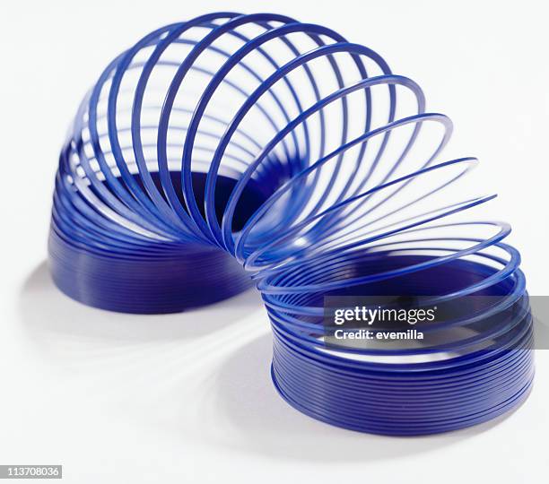 slinky spring toy - metal coil stock pictures, royalty-free photos & images