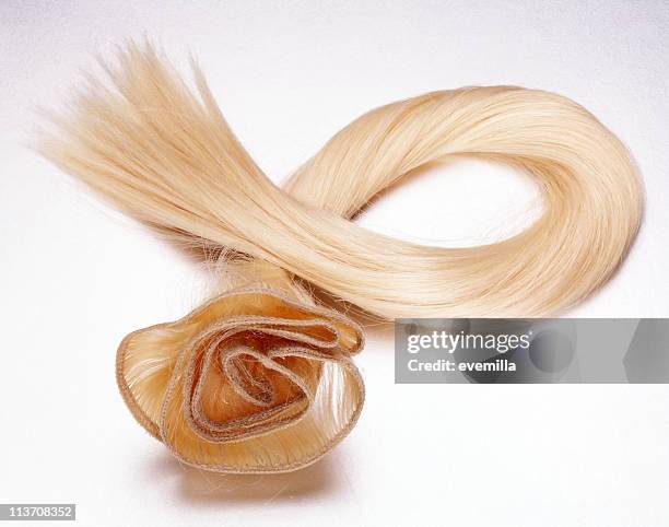 blond hair piece cut out on white - hair extensions stock pictures, royalty-free photos & images