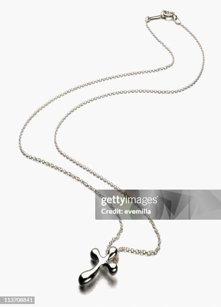 silver cross necklace cut out on white - crucifix shape stock pictures, royalty-free photos & images
