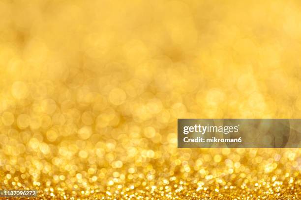 golden glitter background - 2019 gold stock pictures, royalty-free photos & images