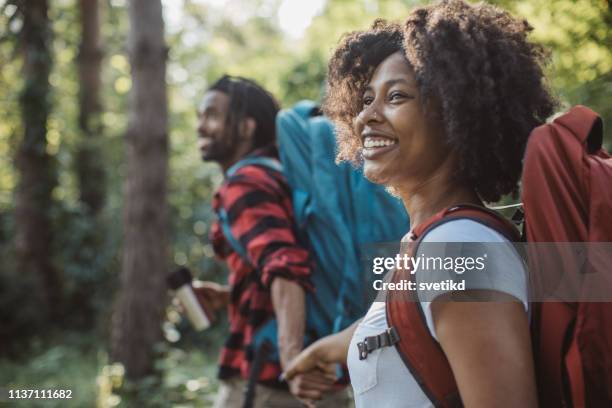 hor drink on forest walk - young couple hiking stock pictures, royalty-free photos & images