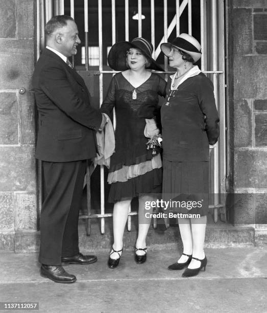 Mae West is seen here being welcomed back to Blackwell's Island jail, where she was incarcerated last year. With her is Lillian R. Sire.