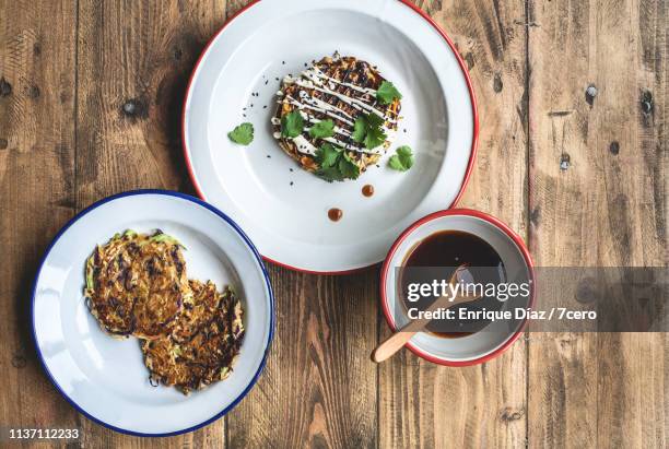 vegan okonomiyaki pancakes, toppings and okonomi sauce - sweet potato pancakes stock pictures, royalty-free photos & images