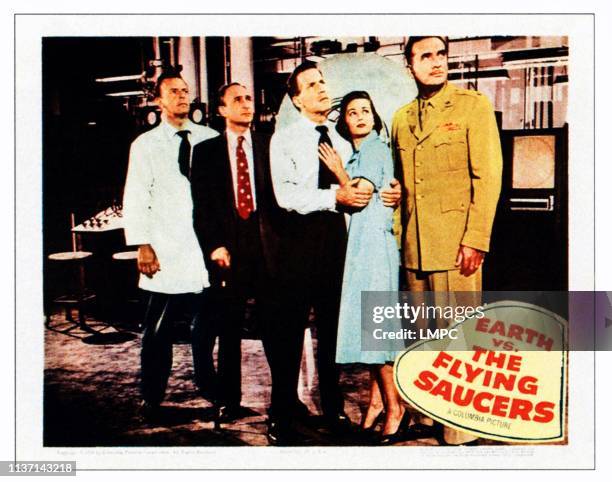 Earth Vs. The Flying Saucers, lobbycard, second from right: Joan Taylor, far right: Donald Curtis on lobbycard, 1956.