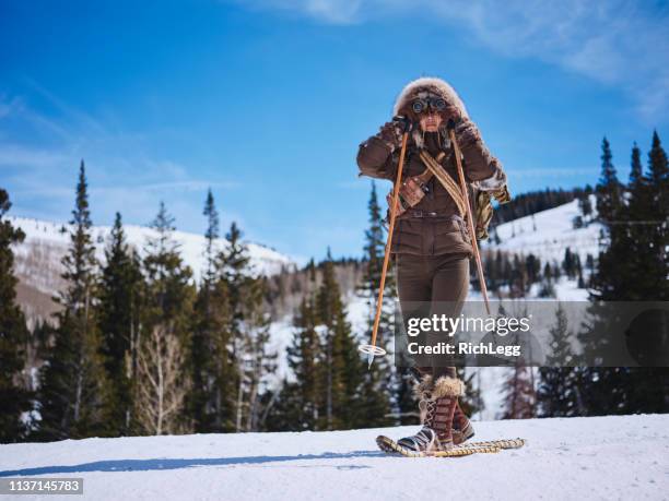 woman winter snowshoeing explorer - parka stock pictures, royalty-free photos & images