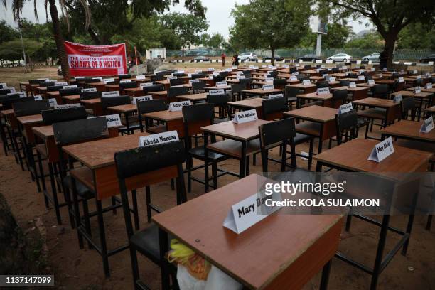 Names of the remaining Chibok schoolgirls are displayed with their desk on April 14 during the 5th Year Commemoration of the abduction of the 276...