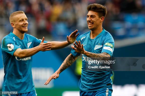 Emiliano Rigoni of FC Zenit Saint Petersburg celebrates his goal with Igor Smolnikov during the Russian Premier League match between FC Zenit Saint...