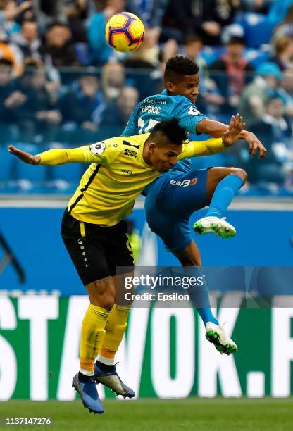 Wilmar Barrios of FC Zenit Saint Petersburg and Andres Ponce of FC Anji Makhachkala vie for a header during the Russian Premier League match between...