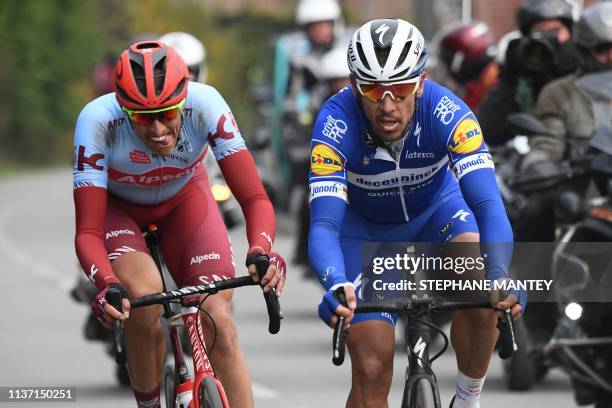 Belgium's Philippe Gilbert and Germany's Nils Politt compete during the 117th edition of the Paris-Roubaix one-day classic cycling race, between...